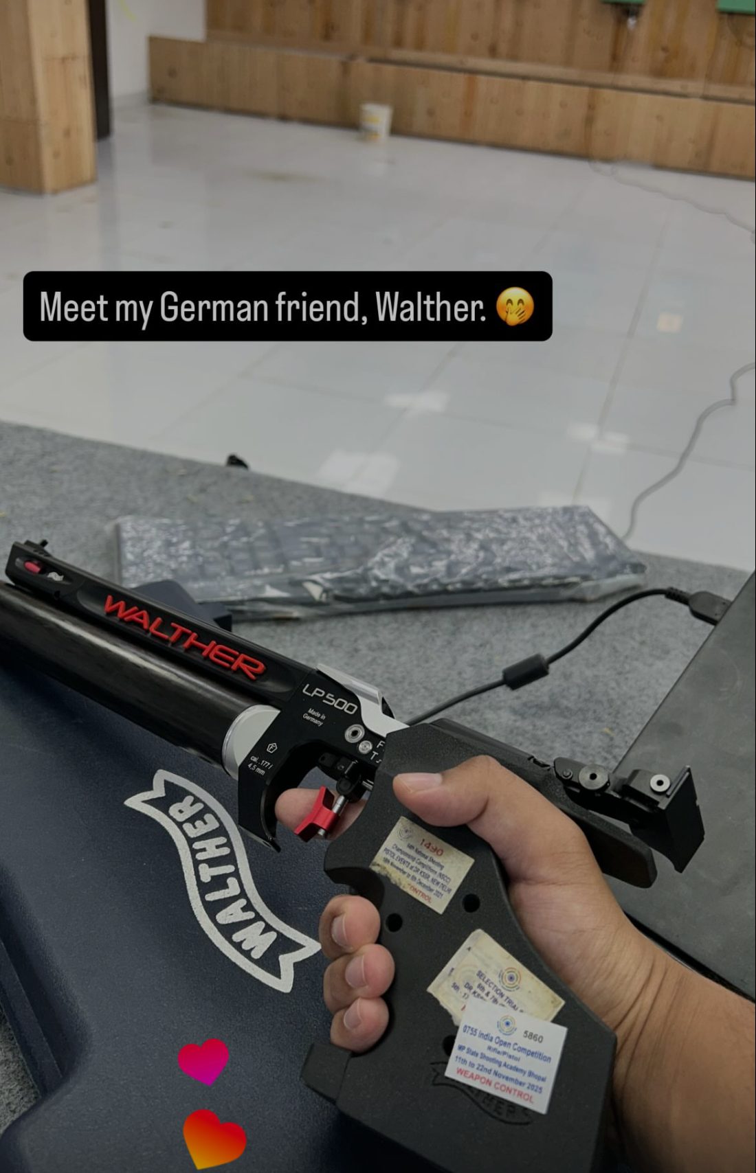 A Walther LP500 air pistol held in hand